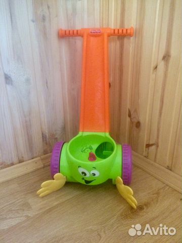 Игрушка- каталка Fisher Price с шариками и музыкой